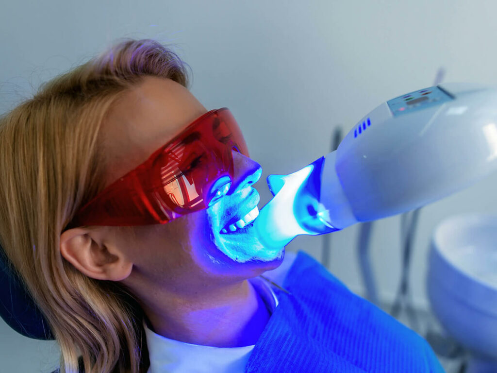 a woman getting professional teeth whitening