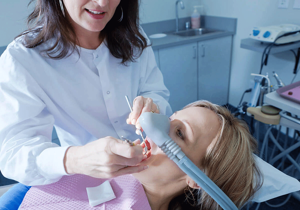 a woman getting sedation dentistry during a dental exam