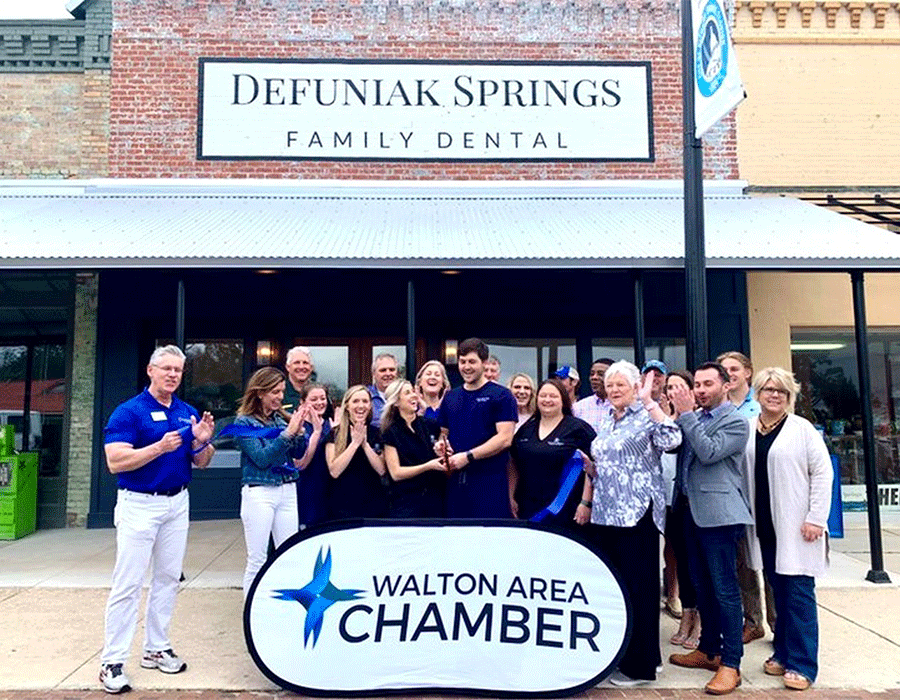 The staff and doctors of DeFuniak Springs Family the ribbon cutting with the Walton Area Chamber